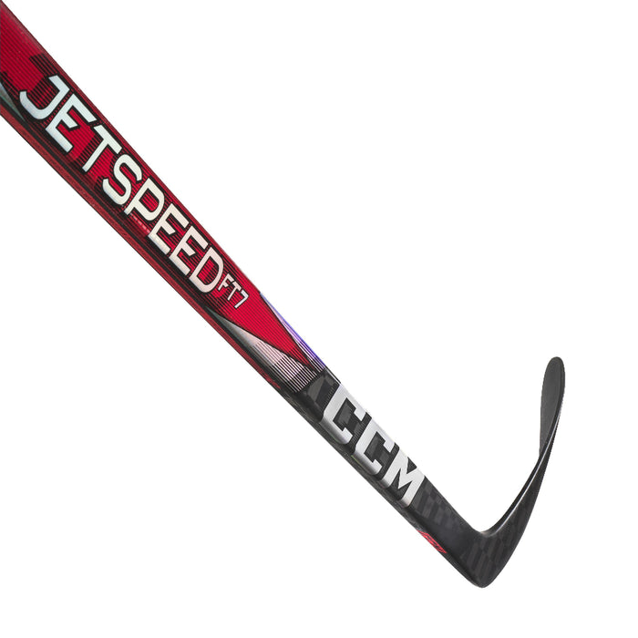 black hockey stick with red mid-section and white writing