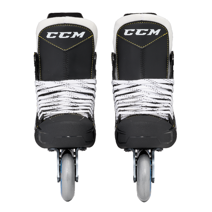 Black inline skates with yellow trim and white laces